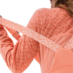 Roxy Women's Summit Bib Shell Pant 2025 - A coral-colored snow bib shell pant with a repeating pattern of hearts and triangles, featuring a zippered pocket on the side.