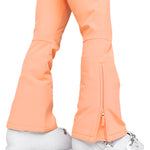 Roxy Women's Summit Bib Shell Pant 2025 - A pair of peach-colored snow pants with a zippered pocket on the left thigh and a small, silver zipper pull.