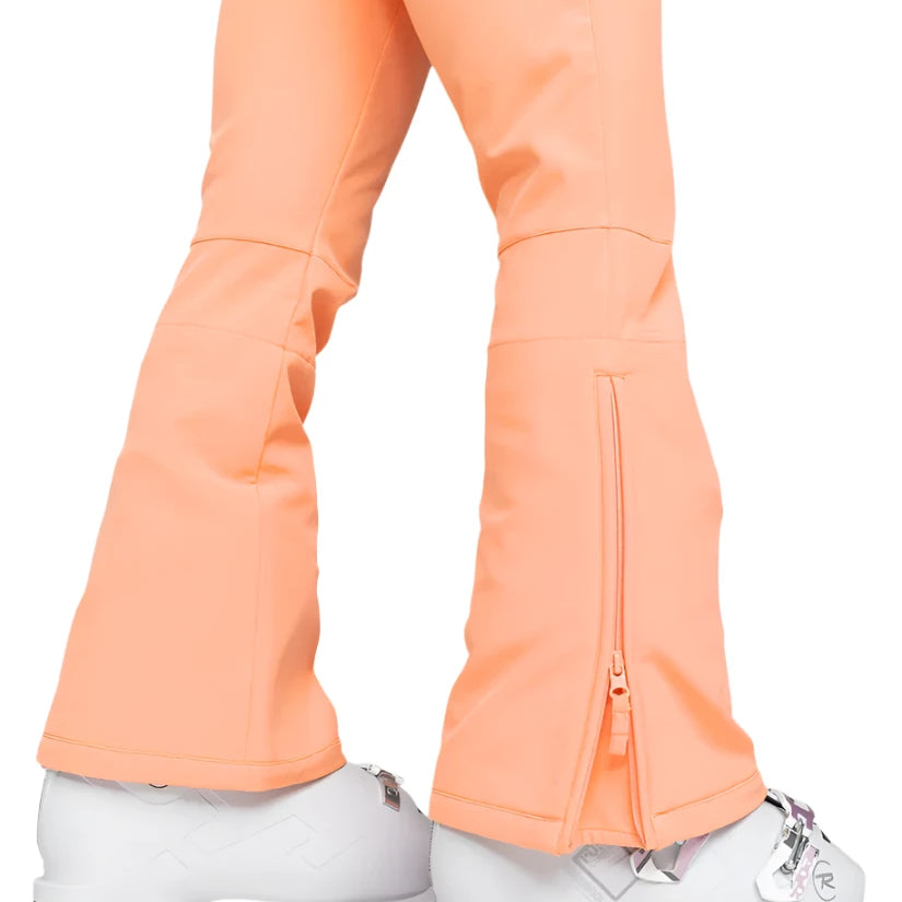 Roxy Women's Summit Bib Shell Pant 2025 - A pair of peach-colored snow pants with a zippered pocket on the left thigh and a small, silver zipper pull.