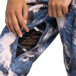 Roxy Women's Nadia Print Insulated Pant 2025 - A pair of blue and white patterned snow pants with a zippered pocket on the thigh.