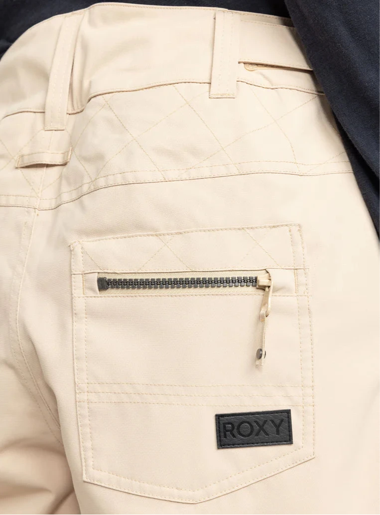 Roxy Women's Nadia Insulated Pant 2025 - A pair of cream-colored snow pants with a quilted pattern on the back pockets and belt loops.