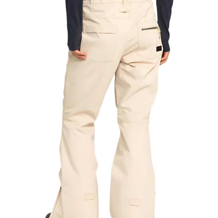 Roxy Women's Nadia Insulated Pant 2025 - A pair of cream-colored snow pants with a zippered pocket on the right thigh and two front pockets.