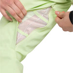 Roxy Women's Diversion Insulated Pant 2025 - A pair of light green snow pants with a mesh lining visible through the fabric on the left thigh.