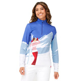 Krimson Klover Mountain View 1/4 Zip Base Layer Top 2025 - A blue and white base layer top with a zipper at the neckline, featuring a woman in a red ski suit standing on a snowy mountain.