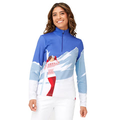 Krimson Klover Mountain View 1/4 Zip Base Layer Top 2025 - A blue and white base layer top with a zipper at the neckline, featuring a woman in a red ski suit standing on a snowy mountain.