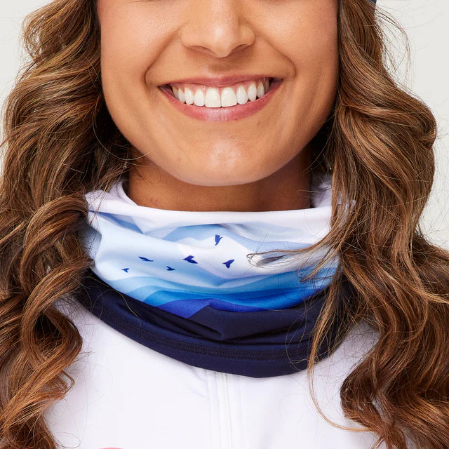 Krimson Klover Women's Mountain Sunrise Gaiter - A gaiter with a sunrise design in shades of orange, yellow, and pink.