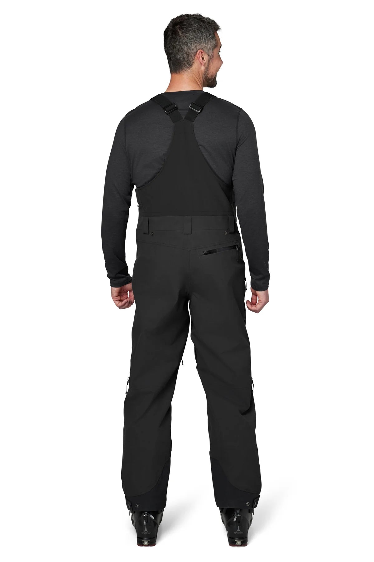 Flylow Baker Bib 2025 - Black bib with black straps, zippered leg pockets, and a flylow logo on the left thigh.