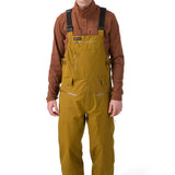 Flylow Firebird Bib - A pair of brown snowboard pants with a zippered fly and multiple pockets.