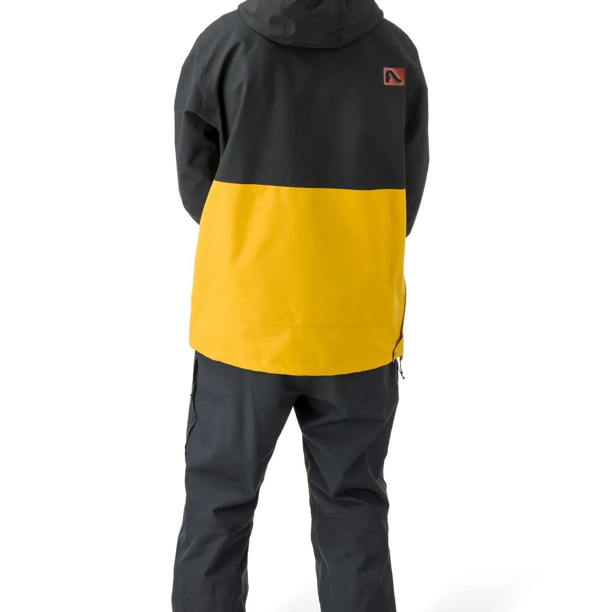 Flylow Knight Anorak Jacket - A black jacket with a yellow stripe across the chest and down the back, featuring a hood and zippered pockets.