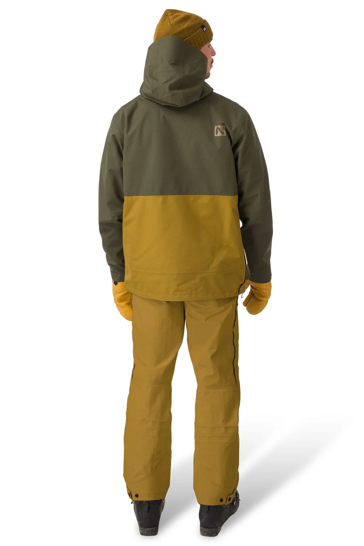 Flylow Knight Anorak Jacket - A dark green jacket with a hood and zippered pockets, featuring a small logo on the upper right side.