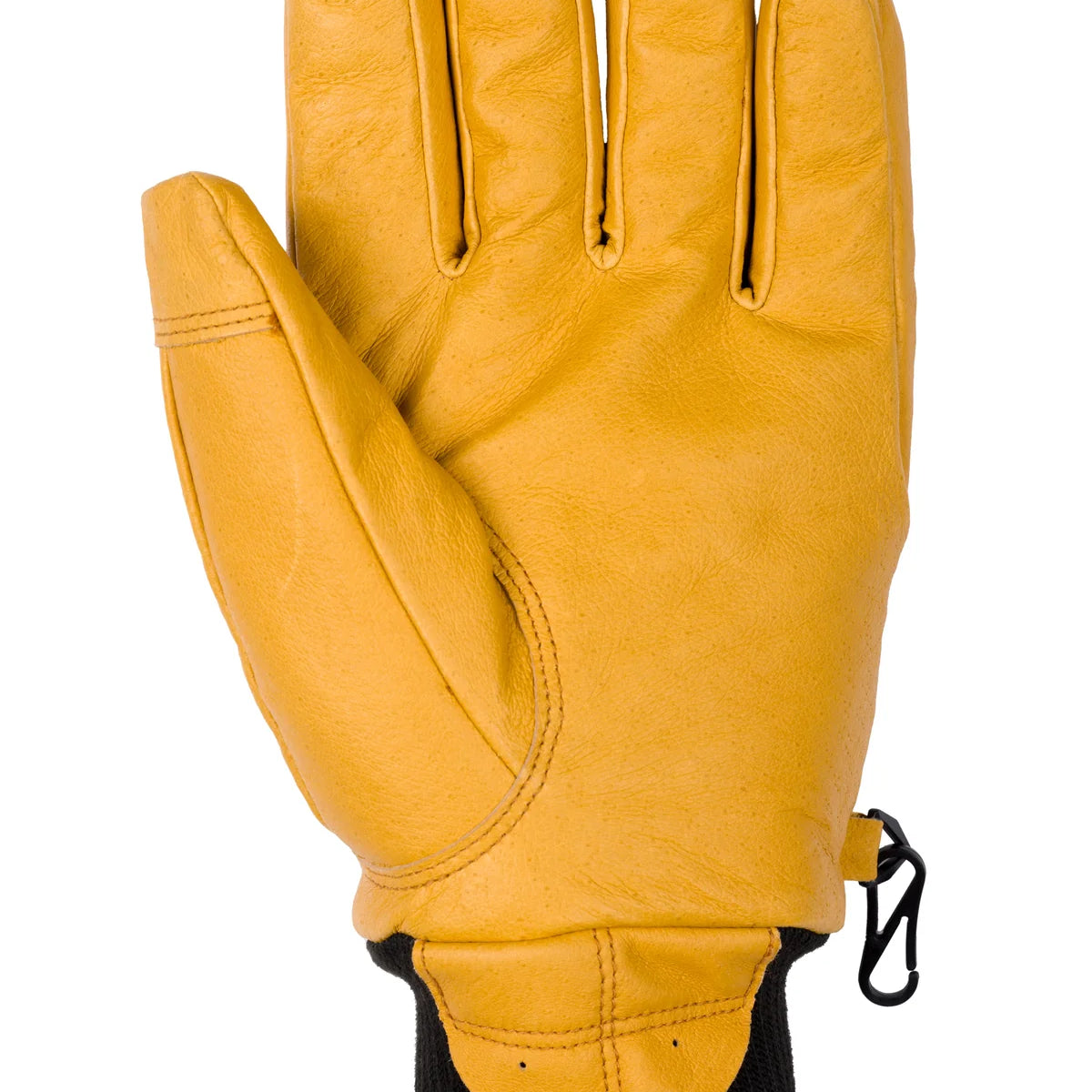 Flylow Magarac Glove 2025 - A tan-colored glove with a textured palm and thumb, featuring a black strap on the wrist.