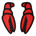 Crab Grab Mega Claw Stomp Pad 2025 - A red crab-shaped pad with a black outline and claws, featuring a textured surface.