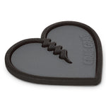 Crab Grab Mega Heart Stomp Pad 2025 - A black heart-shaped pad with a stitched design and the words "crab grab" embossed on it.