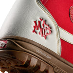 Vans Women's Encore Pro Limited Edition Snowboard Boots 2026 - A pair of snowboard boots with a predominantly white upper and red accents, featuring a distinctive "VANS" logo on the side in red.