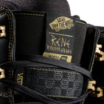 Vans Invado Pro Limited Edition Snowboard Boots 2026 - Black snowboard boots with gold accents and a textured pattern on the side.