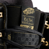 Vans Invado Pro Limited Edition Snowboard Boots 2026 - Black snowboard boots with gold accents and a textured pattern on the side.