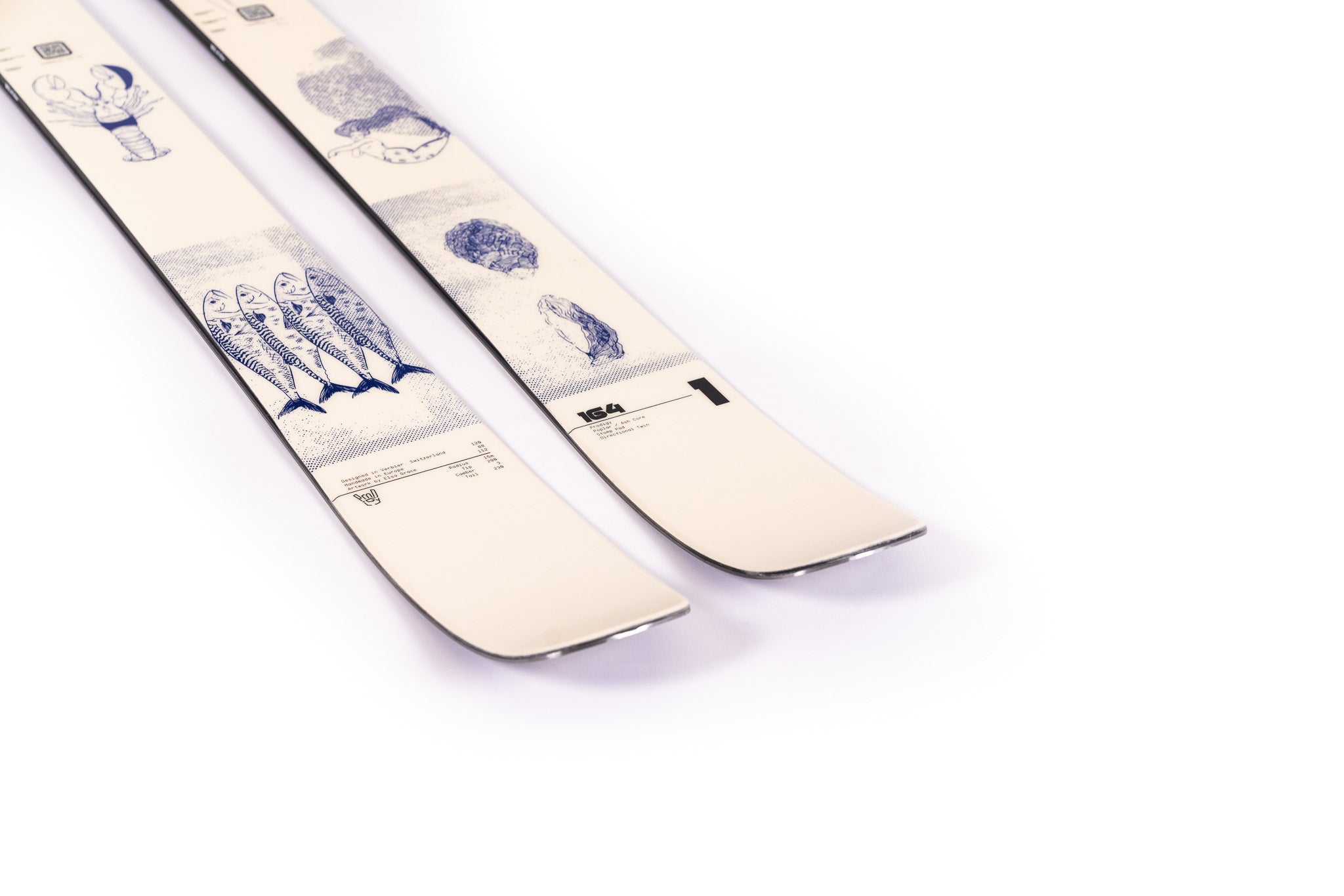 Faction Prodigy 1 Capsule Ski 2025 - A white ski with a blue and black graphic of a person skiing down a mountain, featuring a distinctive capsule-shaped design on the top sheet.