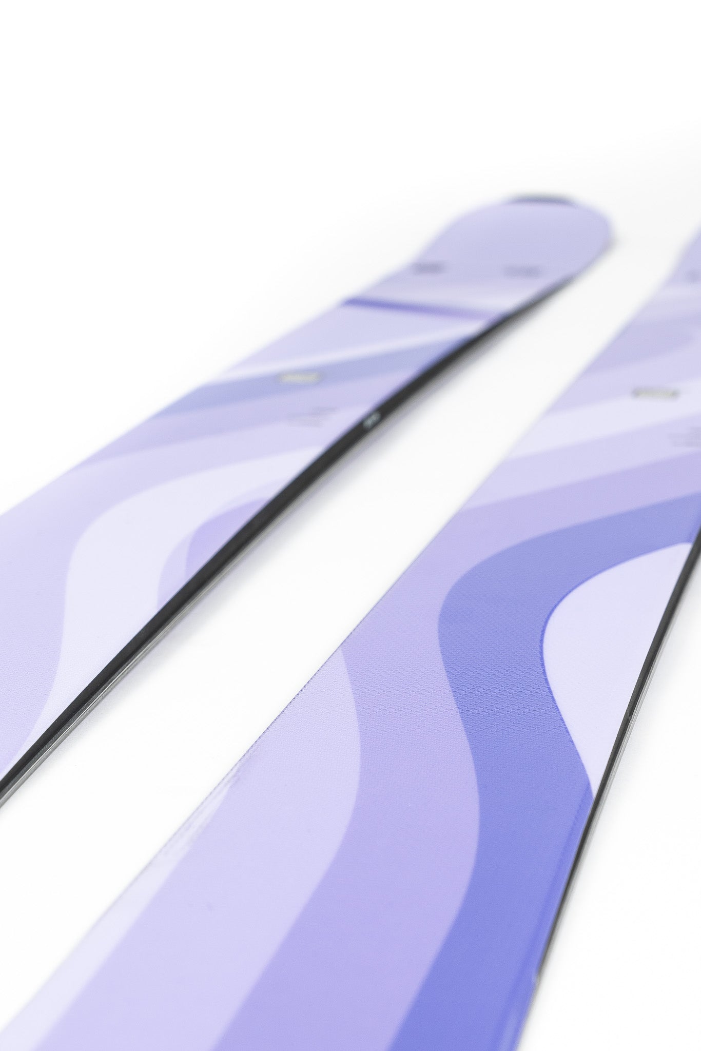 Faction Dancer 2 Ski 2026 - A pair of skis with a light purple base color and darker purple wavy lines on top.