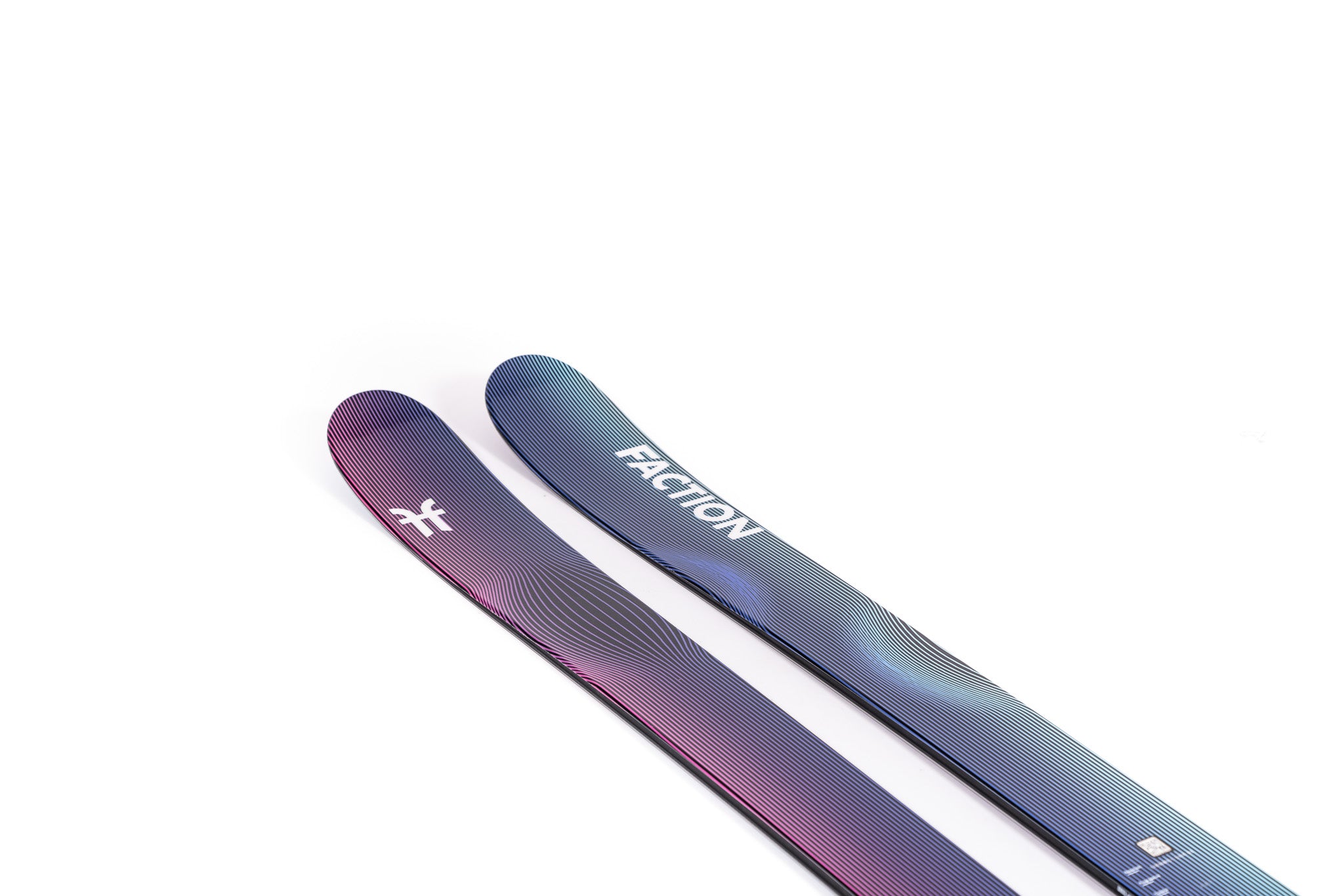 Faction Studio 2 Ski 2025 - A pair of skis with a blue and purple gradient pattern on the top, featuring thin white lines that curve around the edges.