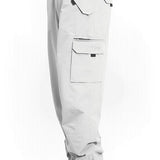 Light gray shell cargo pants with zip fly and flap pockets