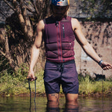 Follow Capiva Impact Vest 2024 - A black vest with a white logo on the chest and straps at the back.