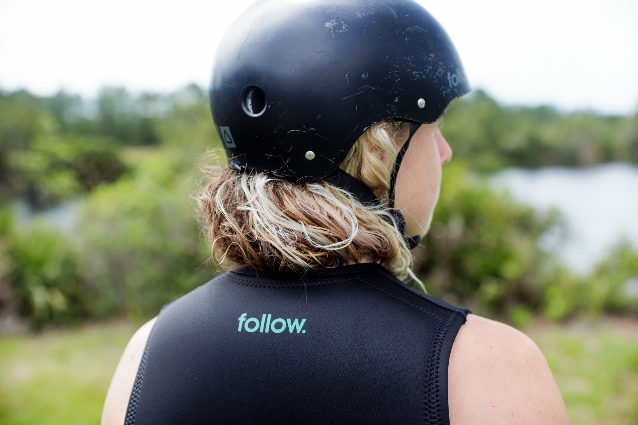 Follow Corp Impact Vest 2024 - Black vest with white logo on chest.