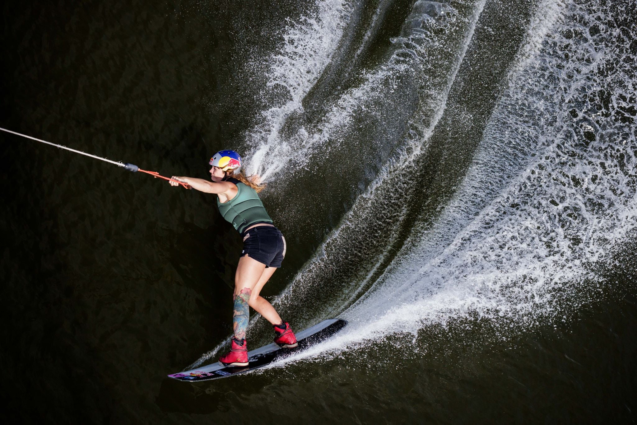 Follow Women's Project One Impact Vest 2024 - A black vest with a white logo on the left chest and a white stripe down the side.