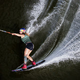 Follow Women's Project One Impact Vest 2024 - A black vest with a white logo on the left chest and a white stripe down the side.