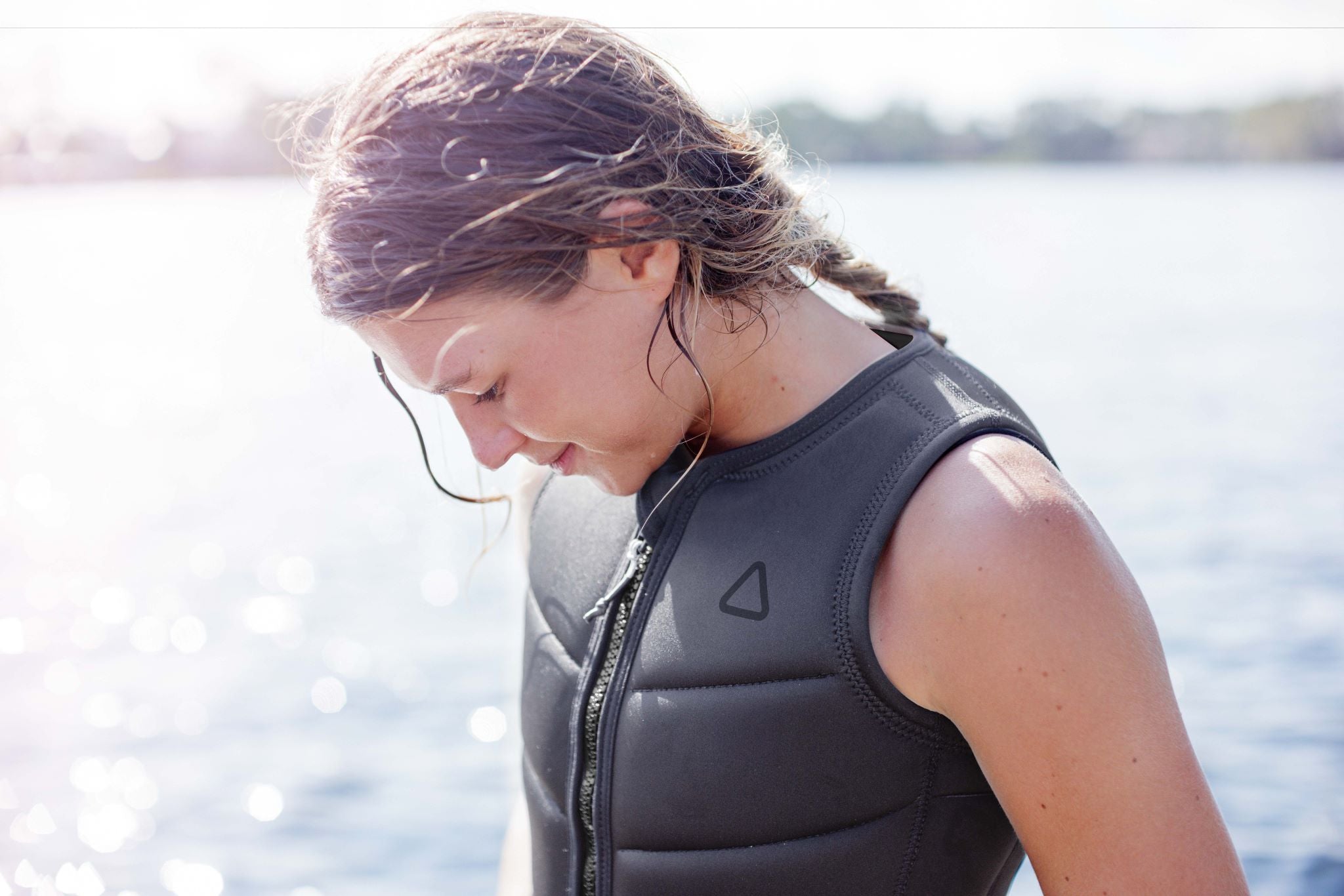 Follow Women's Corp Comp Vest 2024 - Black vest with a black zipper and logo on the left side of the chest.