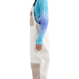 Airblaster Freedom Shell Bib 2025 - White bib overalls with a tan patch on the left thigh and black suspenders.
