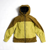 Front view of color-block hooded shell jacket with full-length zip