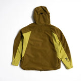 Back view of hooded shell jacket with olive body and yellow-green sleeve panels