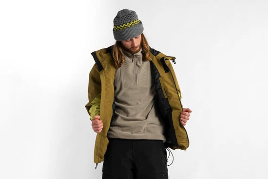 Open shell jacket showing dark lining and adjustable hem