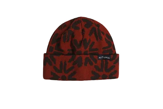 Autumn Craft Beanie in rust red with a black leaf pattern and folded cuff