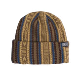 Striped knit beanie in brown, tan, and blue with a folded cuff and woven logo tag