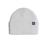 White ribbed knit beanie with a folded cuff and small logo tag