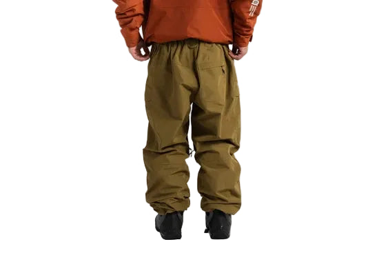 Olive shell pants worn from the back, with an elastic waist and gathered cuffs