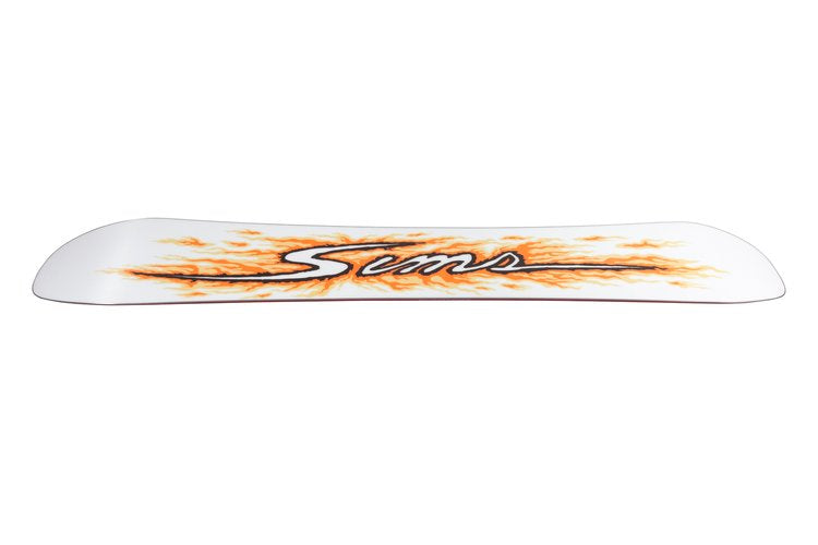 Sims Fakie Snowboard 2025 - A white snowboard with an orange and black flame design on top.