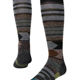 Stance Forest Cover Snowboard Socks 2022 - A pair of snowboard socks with a brown and green forest pattern on a gray background.
