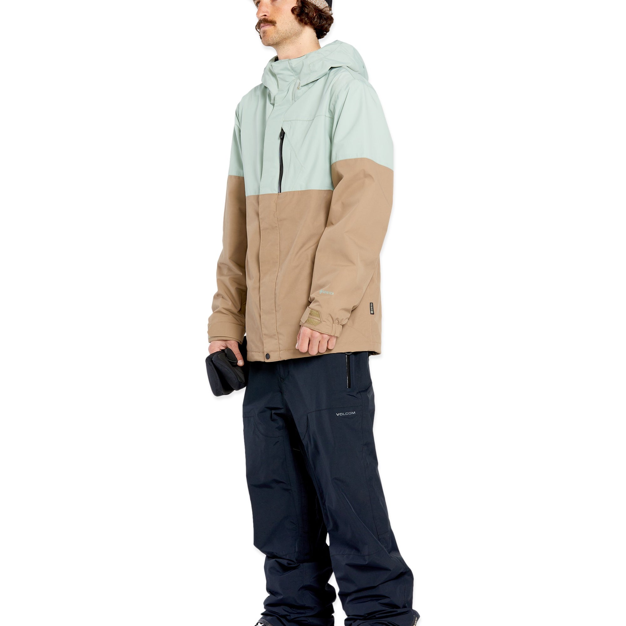 Volcom 2L GORE-TEX Shell Jacket - A tan and light green jacket with a hood, zipper closure, and two chest pockets.