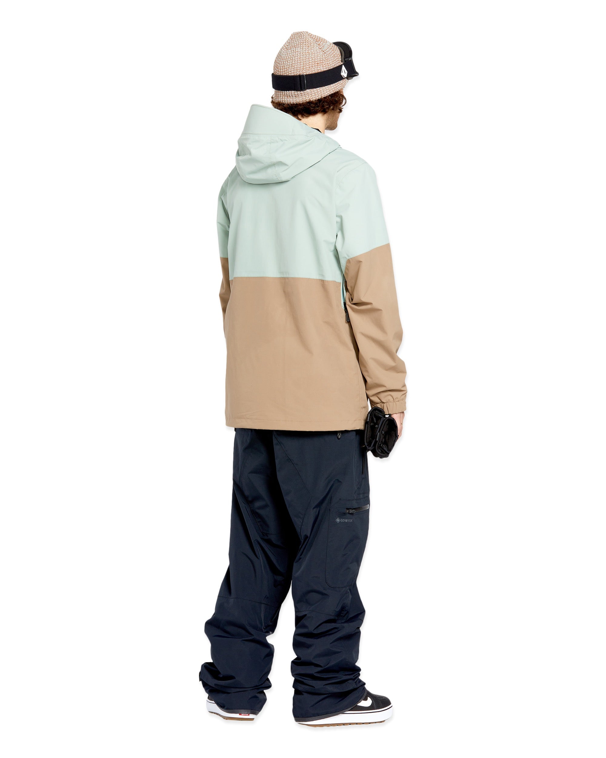 Volcom 2L GORE-TEX Shell Jacket - A tan and light green jacket with a hood, featuring two zippered pockets on the front.