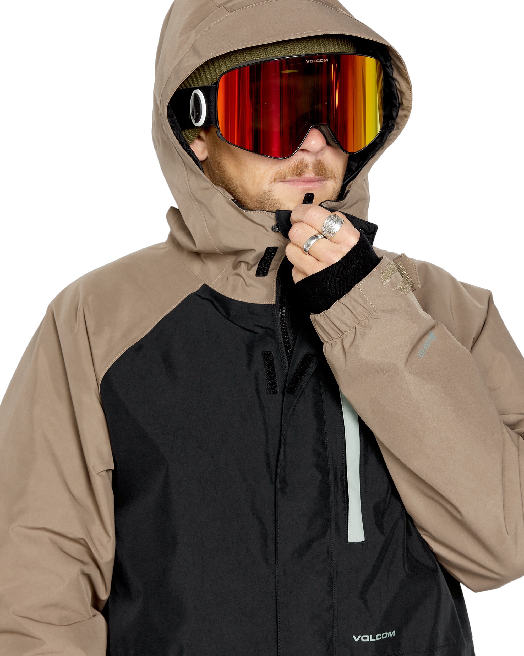 Volcom Men's Dua Insulated GORE-TEX Jacket - A black jacket with a hood, featuring tan sleeves and a tan zipper pull.
