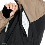 Volcom Men's Dua Insulated GORE-TEX Jacket - A black jacket with a tan hood and chest area, featuring a zipper closure.