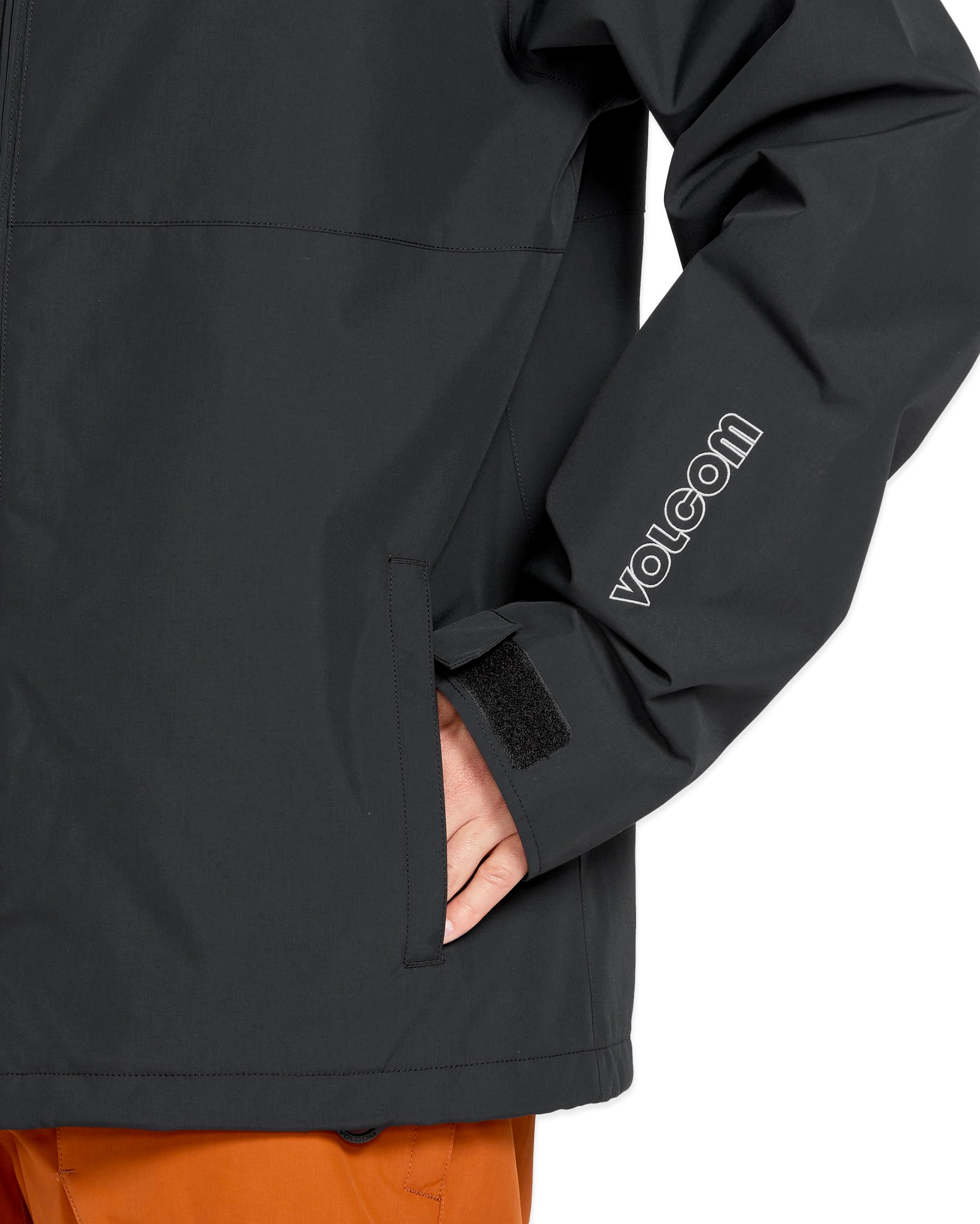 Volcom 2836 Insulated Jacket - A black insulated jacket with a zippered chest pocket and adjustable cuffs.