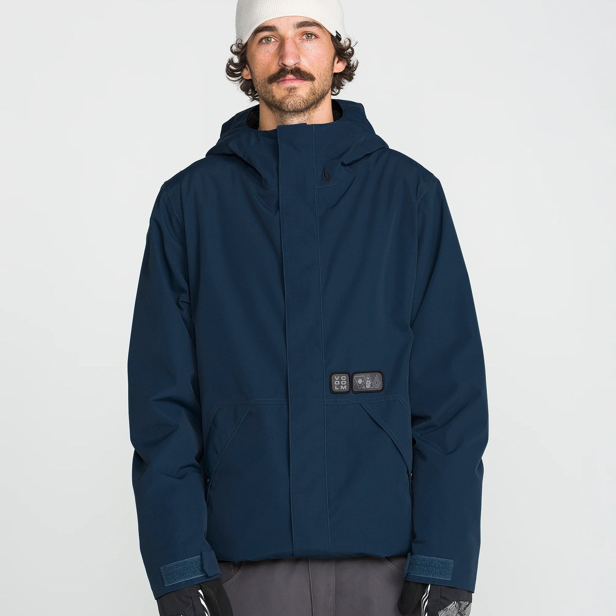 Blue hooded insulated jacket front view with utility chest patch and zip closure