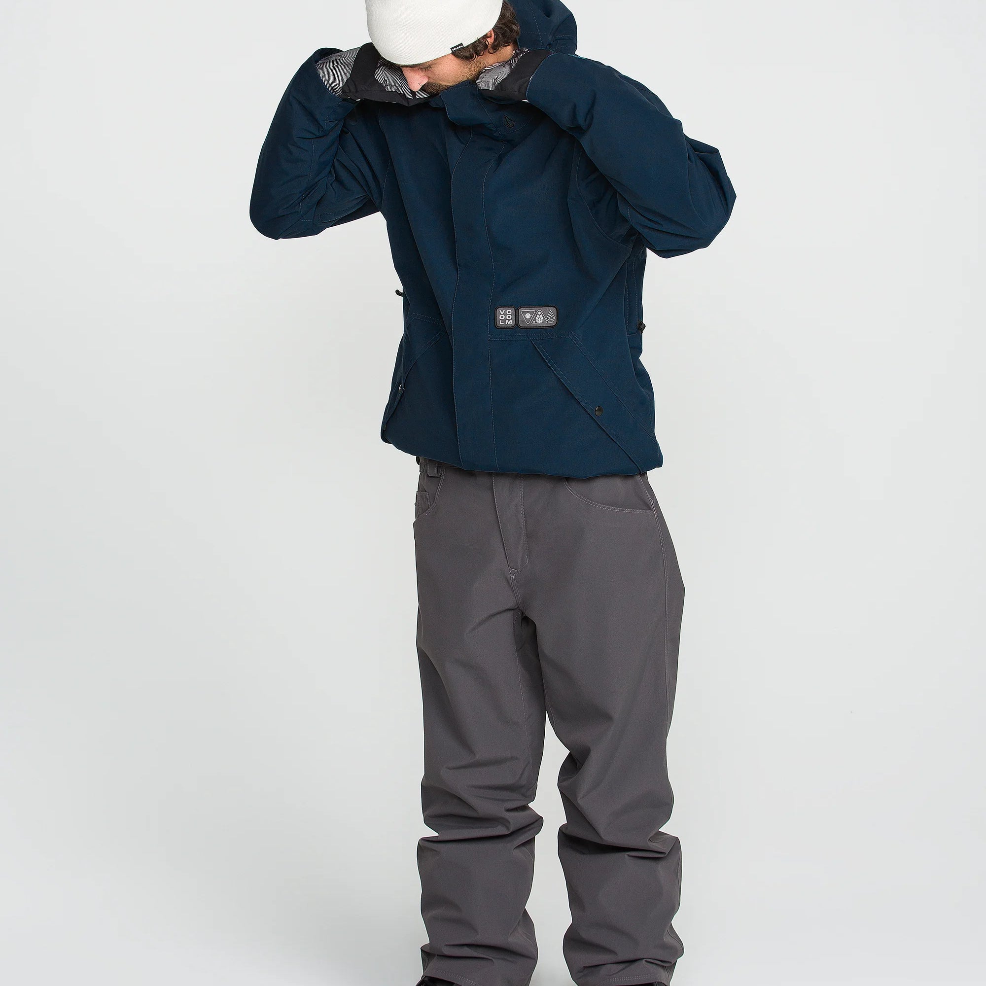 Blue double-insulated hooded jacket with front zip and chest utility patch