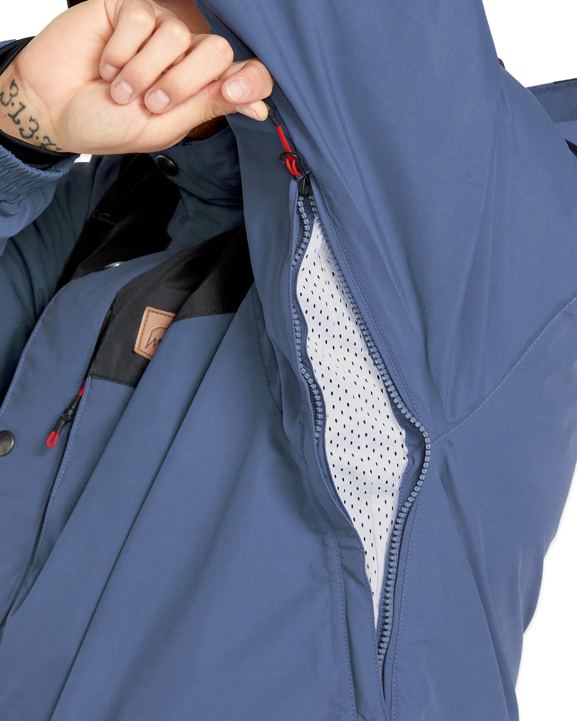 Volcom Longo GORE-TEX Jacket - A dark blue jacket with a brown leather patch on the left chest featuring a white logo and black lettering.