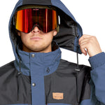 Volcom Longo GORE-TEX Jacket - A dark blue and black jacket with a hood, featuring a zipper closure and two zippered pockets on the front.