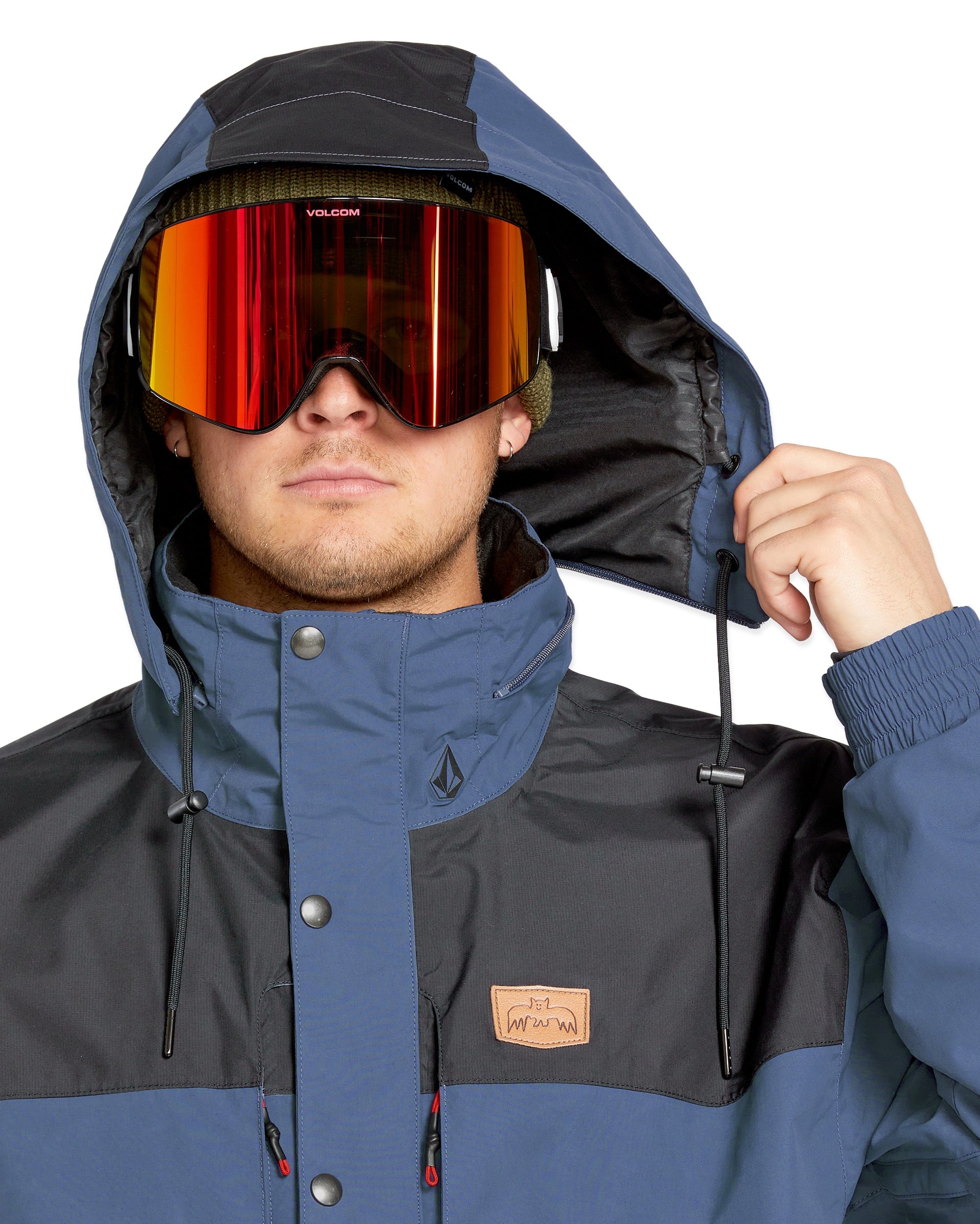 Volcom Longo GORE-TEX Jacket - A dark blue and black jacket with a hood, featuring a zipper closure and two zippered pockets on the front.