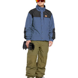 Volcom Longo GORE-TEX Jacket - A blue jacket with black accents and a brown logo on the chest, worn by a model in front of a white background.